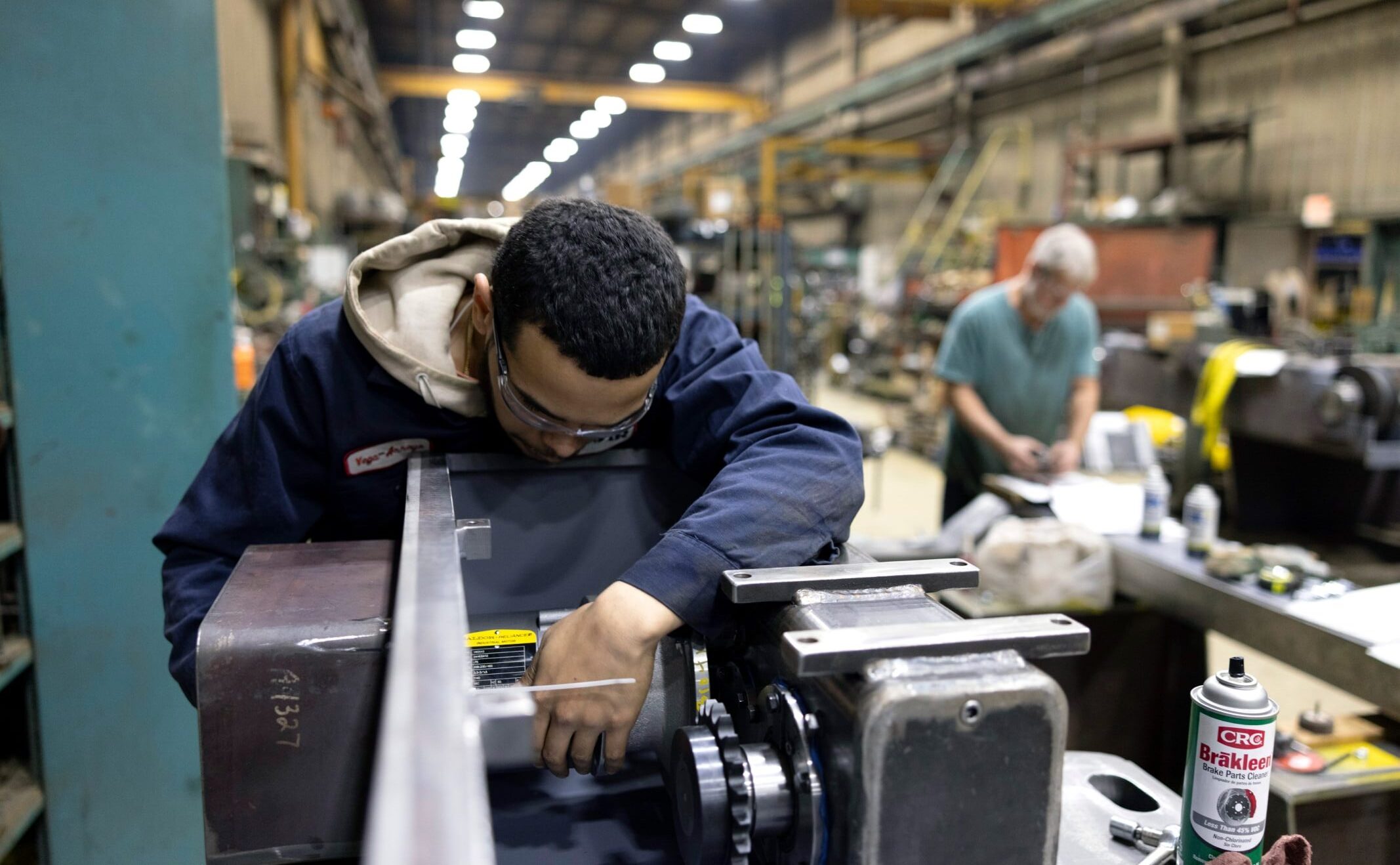 Zenar machinist adjusting part being manufactured