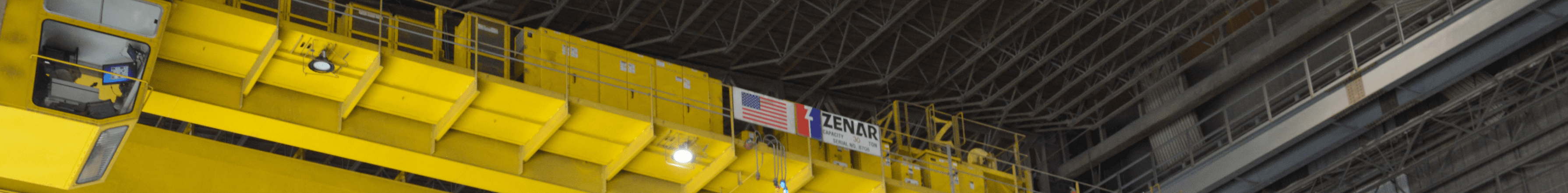 Banner with American flag and Zenar logo on crane